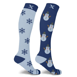 Seasonal compression socks with snowflakes and snow men.